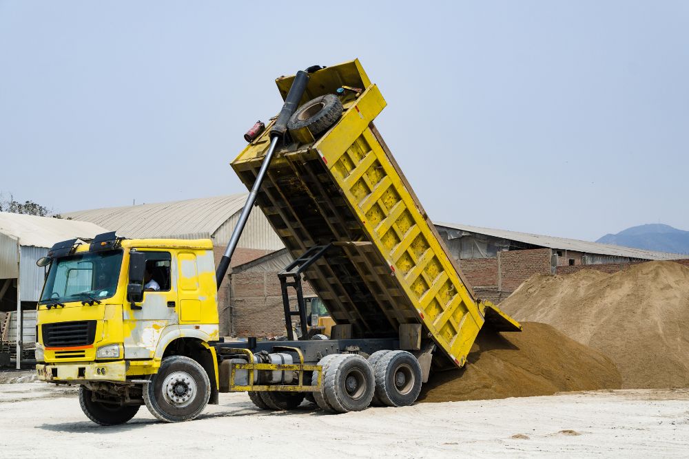 Dump Truck unloading sand